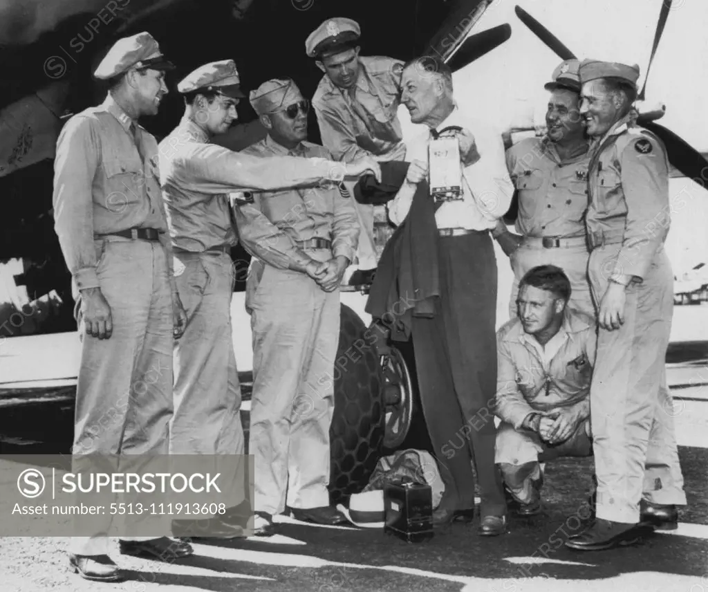 Crew After Record Flight -- Crew members of an army B-29 look over their sealed flight instruments after racing from New York to Burbank today in seven hours, 28 minutes, establishing Larry Therkelsen, official N.A.A. Timer. The fliers, left to right: Capt. B.L. Grubaugh, pilot