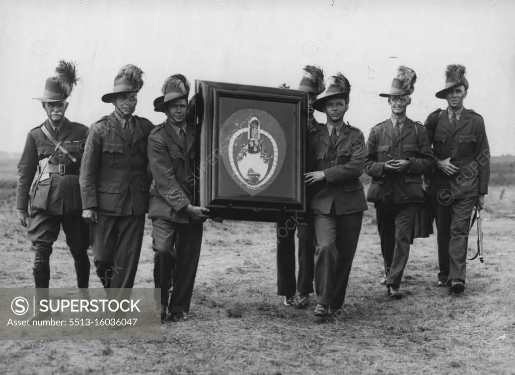 Rifle Shooting: The Australians (the winners) with the Trophy. The empire trophy match at the Bisley ranges, competed for by Australia, Canada great Britain and India. The highest points were scored in that order. The trophy therefore goes back to Australia the land of its birth. July 20, 1937. (Photo by Sport & General Press Agency, Limited).