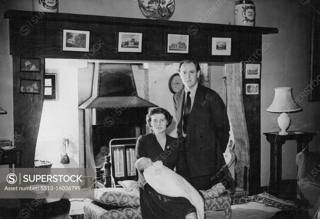 First Pictures Of Mr. Churchill's New Grandchild -- Captain and Mrs. Crhistropher Soames with their baby daughter, Emma Mary, at their home, Chartwell Farm, Westerham, Kent. These are the first pictures of Mr. Winston Churchill's sixth - and latest - grandchild, Emma Mary, baby daughter of Captain Christopher Soames and his wife Mary, Mr. Churchill's youngest daughter. The pictures were made at the Soames' home at Chartwell Farm, Westerham, Kent. The baby, born on 6th September, is to be christened soon, probably at the village church of Westerham. Captain Soames has been chosen as prospective parliamentary candidate by the Bedford Divisional Conservative Association. October 8, 1949. (Photo by Reuterphoto).