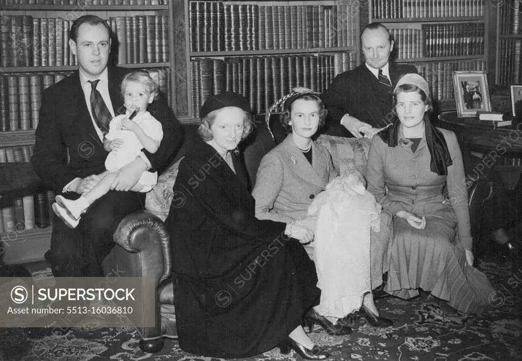 Emma Mary And Godparents After The Christening Today -- Left of right, Capt. Christopher Soames holding his son, Nicholas; Mrs. Duncan Sandys, daughter of Winston Churchill; Lady Rupert Nevill, godmother of the baby, Emma Mary Somes whom she is holding; M. Andre de Staree, godfather of the child; and Mrs. Christopher Soames, the child mother, at the Christening reception today in the home of Capt. G. Soames, at Sheffield Park, Fletching, Sussex. Mr. Winston Churchill and Mrs. Churchill attended the christening of a grandchild today (Sunday) in the 13th century church at Fletching, Sussex. November 6, 1949. (Photo by Reuterphoto).