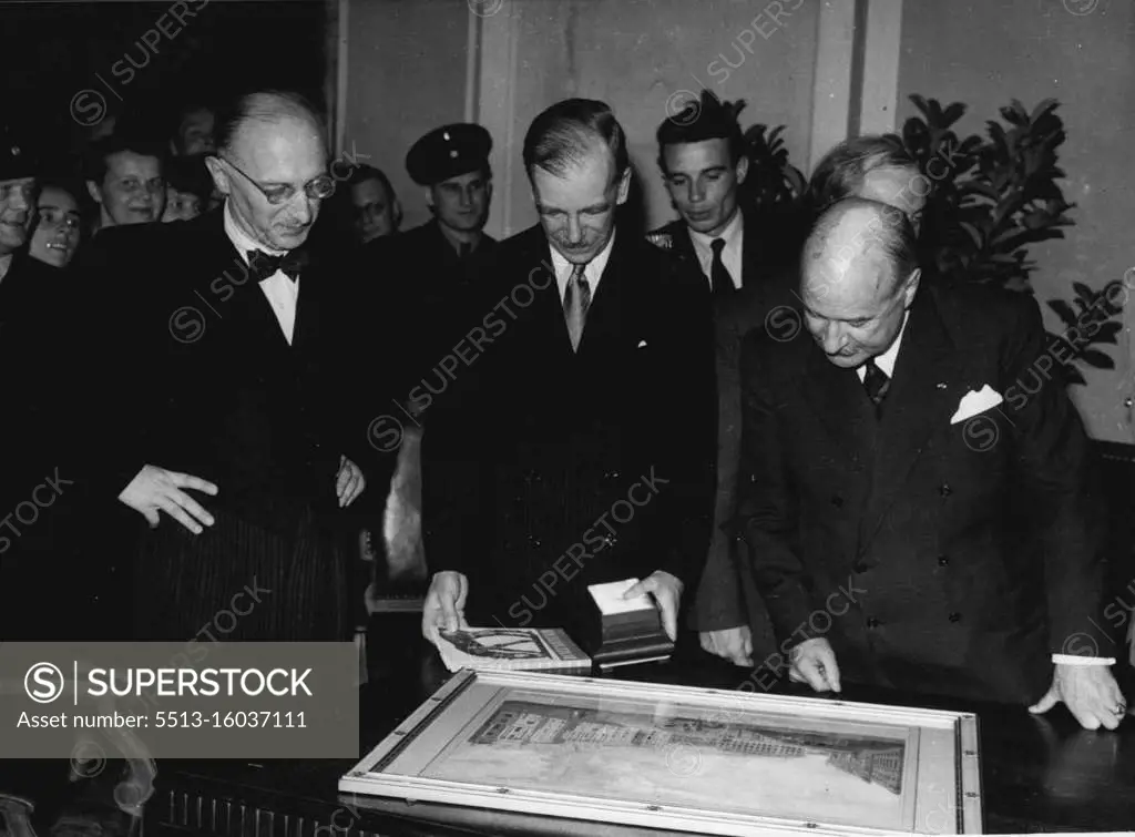 General Robertson Says 'Good-Bye' To Berlin., Addresses Session Of West Berlin Council -- General Robertson admiring a painting of Old Berlin, which was presented to him by Professor Reuter, Mayor of Berlin. On left is Dr. Suhr and on right M. Francois-Poncet.... General Sir Brain Robertson who is leaving Germany this week to take up an Army appointment in the Middle East, paid a special visit to Berlin to say good-bye to his many allied friends and Germans......During his short visit he addressed a special session of the West Berlin City Government in the Schoneberg Town Hall in the U.S. Sector. June 19, 1950. 