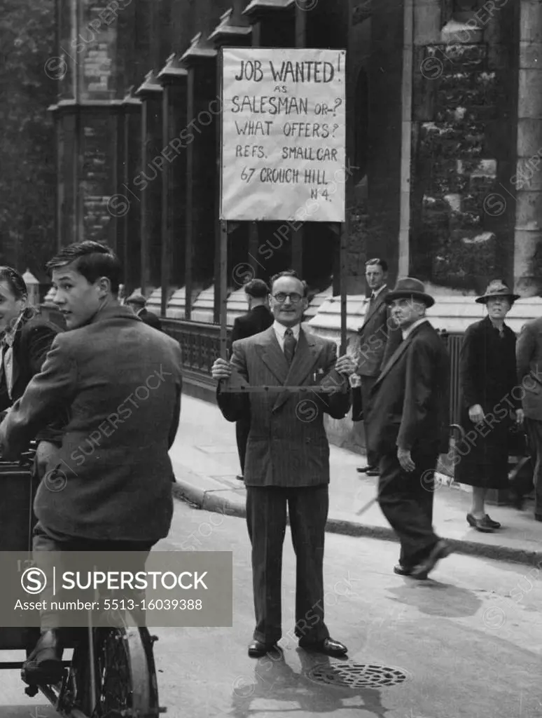 "Selling Himself" -- Mr. Arthur Clements 38 of Finsbury Park, North London, is an expert salesman, with one of the chief qualifications that such a job demands, the ability to "sell himself"..... In fact, when Britain's boosted expert trade did him out of his pre-war door-to-door sales, that's just what he did! Here he is selling himself" near London's West End. He had crept out with his home-made board, (adapted from a wooden blackout frame), while his wife was out shopping. August 2, 1946. (Photo by Mirror Features). 