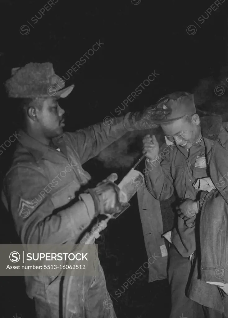 Korea Pows en Route to Chiang Kai-Shek -- A freed Chinese Laughs as he gets a routine de-lousing spray at Ascom City before moving on to inchon and Formosa. Following the release of Nearly 22,000 Chinese and North Korean prisoners of war by their Indian custodians, Thousands of Chinese have been streaming to inchon to Board tank-landing shops which will take them to Formosa. American warships and planes will Escort them to the Nationalist China island ruled by Chiang Kai-Shek. The trip will take three days. January 26, 1954. (Photo by Associated Press Photo).