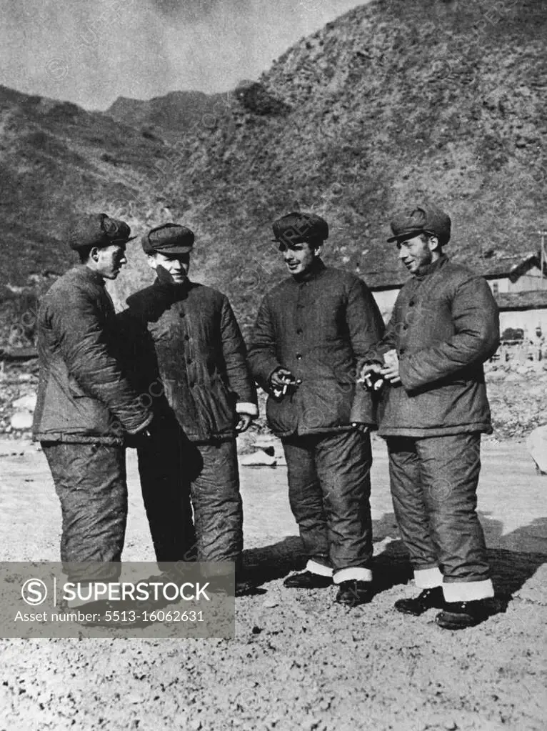 British Prisoners of War In North Korea -- Four British prisoners of war who were captured in November 1951 by the Chinese people's volunteers. Picture shows the POWs are wearing their new issue of cotton-padded winter clothes supplied by the Chinese people's volunteers. From left to right; Eric Wragg (22426986), "B" Co., 1st Royal Leicester 29th Brig. Address: 34 Outram Road, Wyboorm Estate, Sheffield 2, England: William Walker (22391663), "B" Co., 1st King's Own Scottish Borders. Address: 23 Keyden Street, Kinning Park, Glasgow, Scotland; George Marshall (22436971) 1st Brn., Royal Leicester Regt. Address: 10 Butter Road, Bilton, Harrogate, Yorkshire, England, and David Whittaker (22431499) "B" Co., 1st Bn., Royal Leicester Regt. Address 29 Cherdle Street, Burnley, Lancashire, England. July 11, 1952. (Photo by Camera Press).