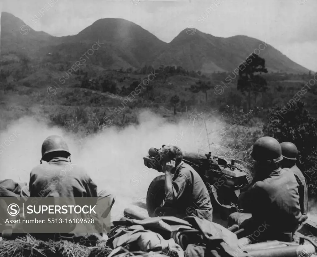 Airborne Artillery-- Shown her firing into Jap positions on Negros Island, Philippines, in an airborne gun crew and 75-mm, pack howitzer of the 503rd Regimental Combat team which jumped on Corregidor a few weeks ago to wipe out Jap defenders. Men are highly trained a specialists in every type of fighting. April 25, 1945. (Photo by USA Signal Corps).