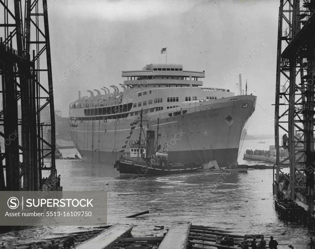 Southern Cross Afloat - Proudly riding the water after her launching by the Queen today (Tuesday) is the new Shaw Savill luxury liner the Southern Cross, built at the Belfast yard of Harland and Wolff. The ship, of 20,000-tons, has funnel and engines is stalled aft like an oil tanker and is intended for service between Britain and Australia and New Zealand. She cost more than seven million pounds and will not carry any cargo. August 17, 1954. 