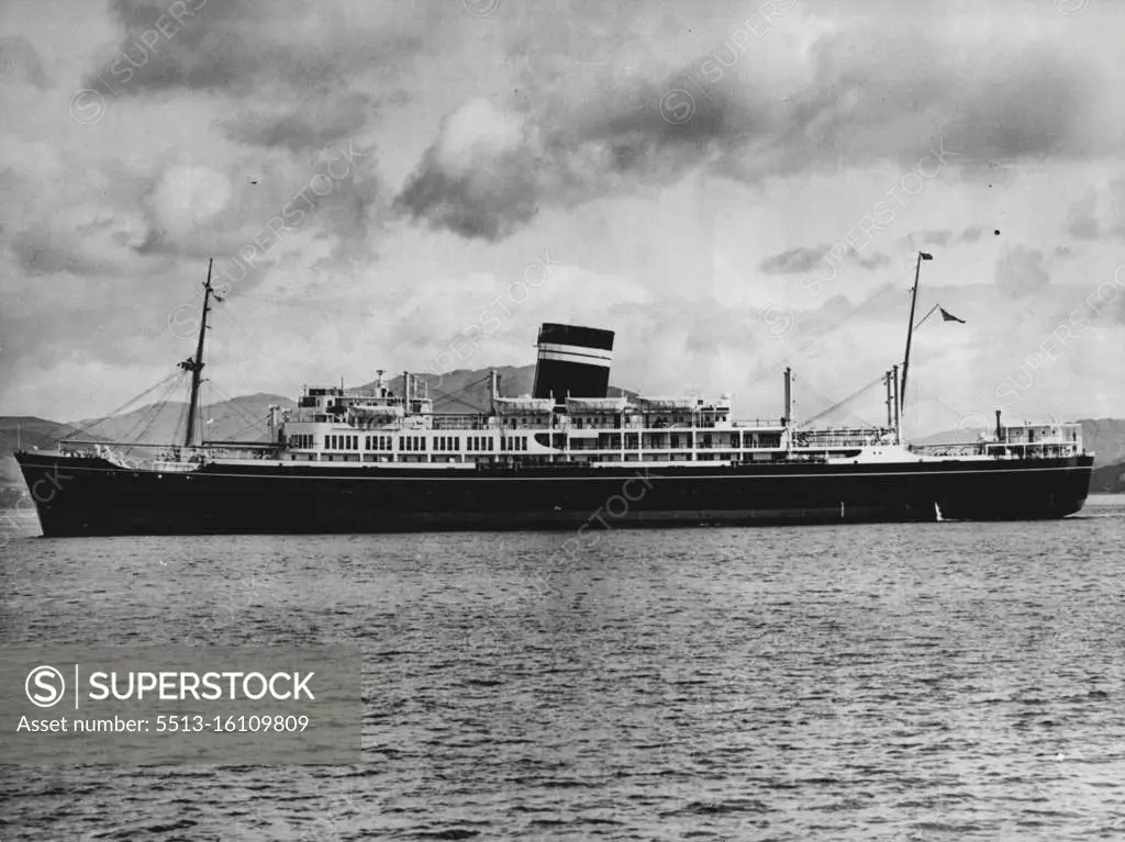 A Steamer Launched In A Gale -- A new 15, 000-ton steam ship met her first gale a minute after she was launched on the Clyde at Glasgow. She is the British India Steam Navigation Company's Uganda and she is pictured here as she is swept broadways across the river by the first 'big blow' of the gales that swept Scotland with winds up to 65 and 120 miles per hour. Just as the Uganda glided down the skipway, winds caught her. The tugs had not yet linked up. She was blown, bow first, back on to the end of the launching ways and remained jammed in the position for 20 minutes before being freed. January 16, 1952. (Photo by Reuterphoto).