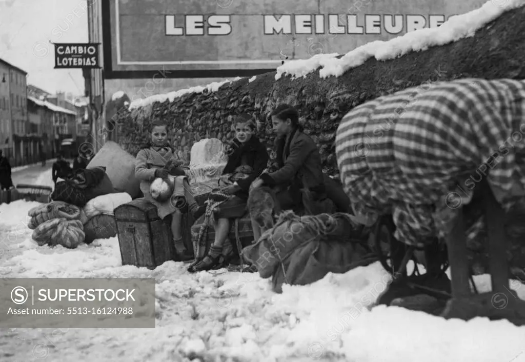 Spanish Refugees Of The Franco-Spanish Frontier -- Children sitting on their luggage near the Bourg-Madame bridge on the Franco-Spanish frontier. February 20, 1939. 