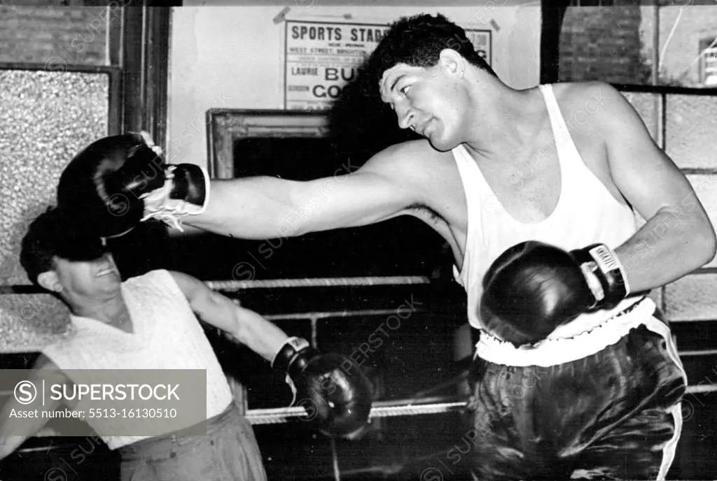 Giant South African Boxer To Have His First Contest In England. Ewart Potgieter in action during training. Ewart Potgieter, the giant South African heavy weight boxer, is now finishing off his training in readiness for his contest against Simon Templar at the White City Stadium, London. September 12, 1955. (Photo by Sports and General Press Agency Limited)