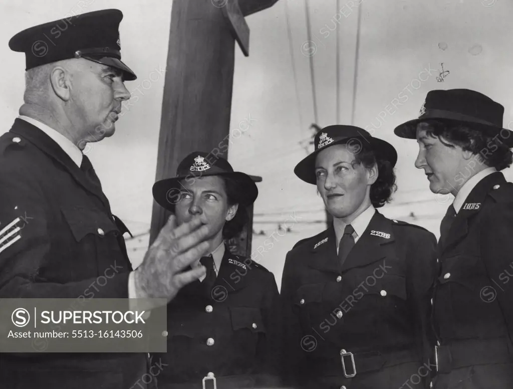 Final Advice: Sergeant Martin gives a last word of advice to police women Betty Stirton and Priscilla Hughes at the conclusion of their six months training in traffic control. On Monday the girls will start their duties at school intersections and will also lecture to children on Safety First. October 14, 1950. 