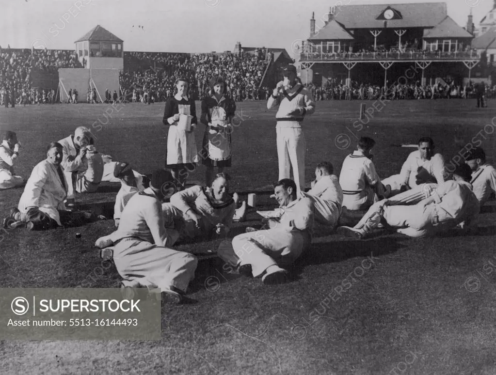 The 1945 Australian Services team discusses legends of the Scarborough wicket as they have afternoon tea. August 17, 1948.