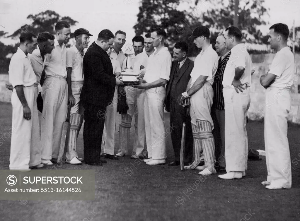 Cricket Trophy Handed Over - Mr. R. Tait, of the Railways Institute over "The Sun" challenge cricket trophy to the Sydney Railways Yard Club. April 08, 1937.