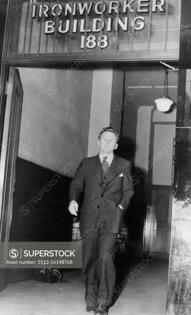 Mr. L. Short, who was made by the Arbitration Court-National Secretary of the Iron Workers Federation is seen her leaving the building of the Ironworkers federation this afternoon. November 30, 1951. (Photo by Kenneth Issitt).