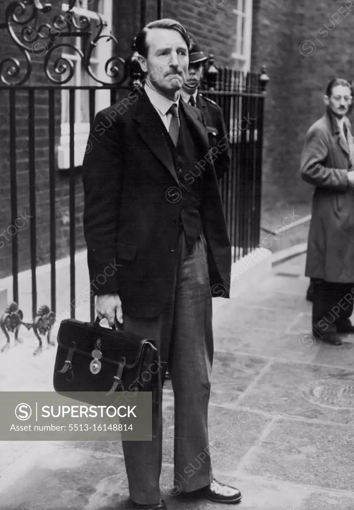 Cabinet Meets On Abadan Crisis -- Solicitor General Sir Frank Soskice photographed looking solemn as he leaves No. 10 Downing Street after the Cabinet Meeting. The cabinet met this morning at No. 10 Downing Street to discuss the serious situation which has arison following the order by Persian Premier Mossadeg to blow up all the Abadan oil installations if foreign troops try to land in the country. September 27, 1951. (Photo by Fox Photos).