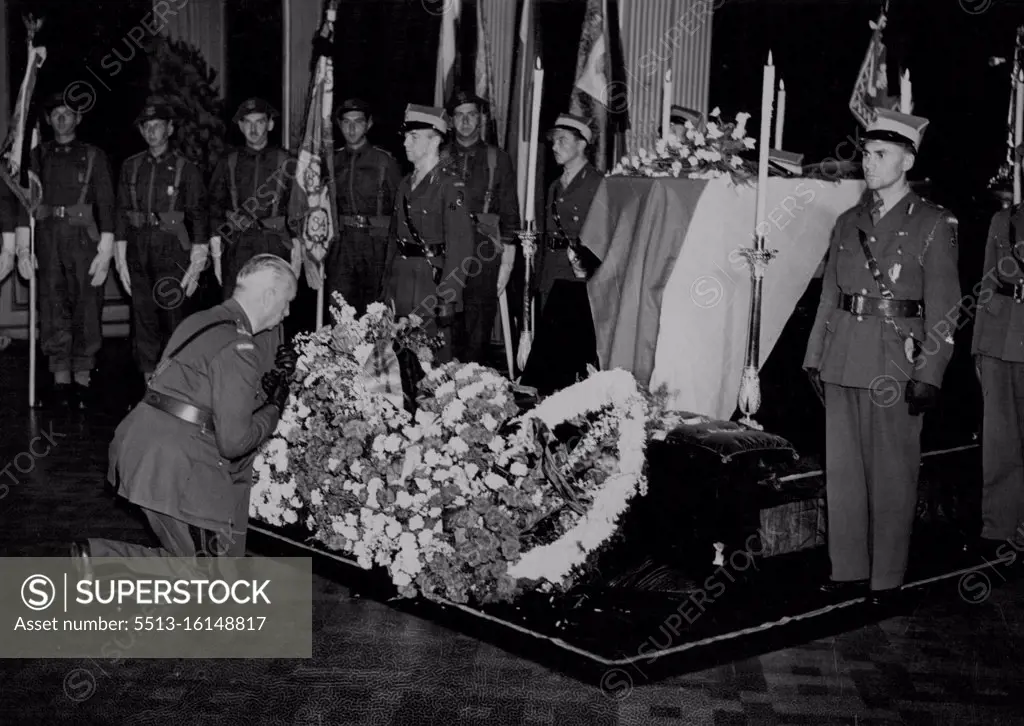 General Sikorski Lying In State In London -- General K. Sosnkowski (C-in-C) successor to General Sikorsko, pays homage at the lying-in-state today. In a plain coffin draped in the Polish flag, the remains of General Sikorski were brought to London yesterday, where the body will lie in state at the Polish Government H.Q. in Kensington Palace Gardens, London S.W. July 12, 1943. (Photo by Fox Photos).