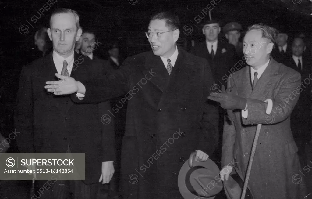 Soong - Chinese Foreign Minister and Brother of Madame Ching Kai-Shek Arrives in London. Dr. T. V. Soong (centre) with Dr. Wellington Koo, the Chinese Ambassador in London (right) and Sir Maurice Peterson, Undersecretary at the Foreign Office, photographed at a London station. Dr. T. V. Soong, the Chinese Foreign Minister, has arrived in London at the invitation of His Majesty's Government. He took part in the recent Washington talks with Mr. Winston Churchill and President Roosevelt. July 24, 1943.