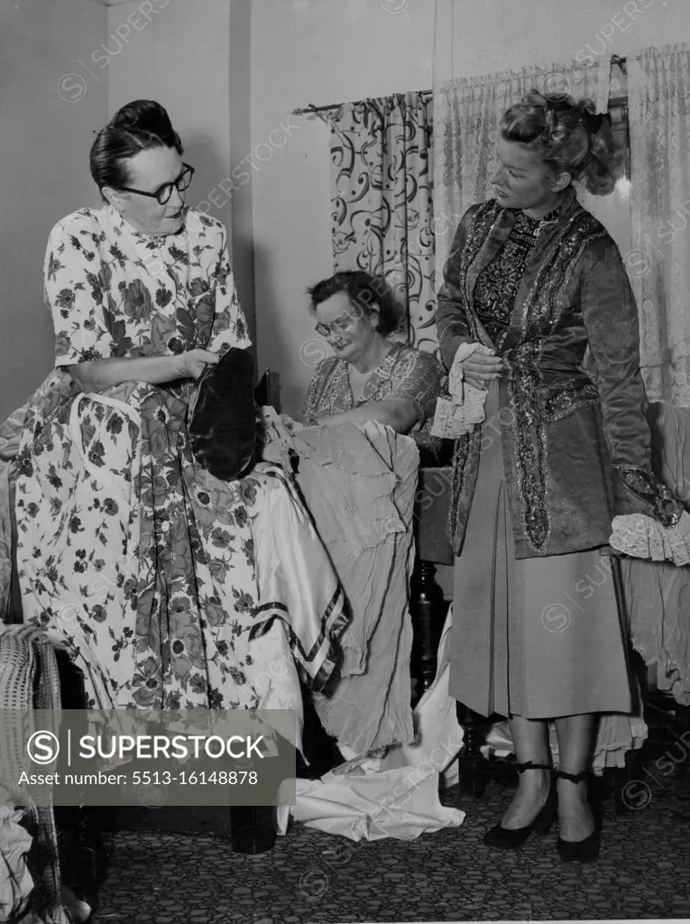 Grace le Brun, ballet mistress, tries on a Puss in Boots costume in Grace Sorlie's *****. March 12, 1952.