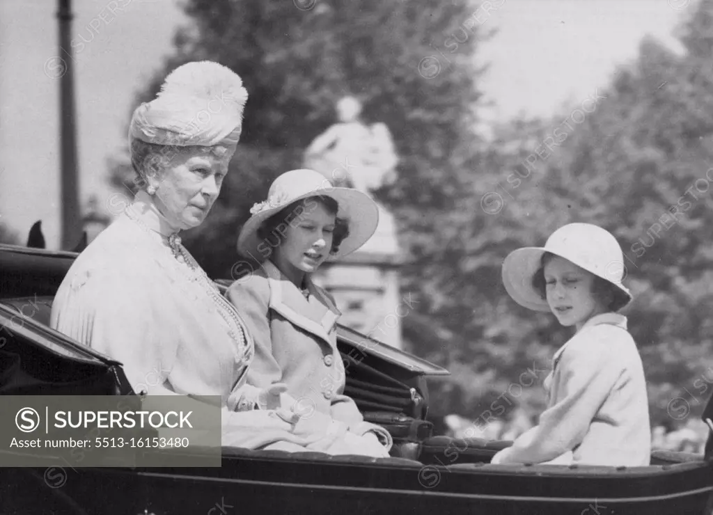 Queen Mary and Princess Drive To Trooping Of The Colour -- Queen Mary and Princess Elizabeth (beside her) and Princess Margaret Rose diving across the Horse Guards Parade. This was done for the first time on this occasion, the Admiralty Arch having been used previously. The King and his brothers and Queen Mary and the two Princesses attended the Trooping of the Colour ceremony, official celebration of the King's birthday, on the Horse Guards Parade, London. June 9, 1938.