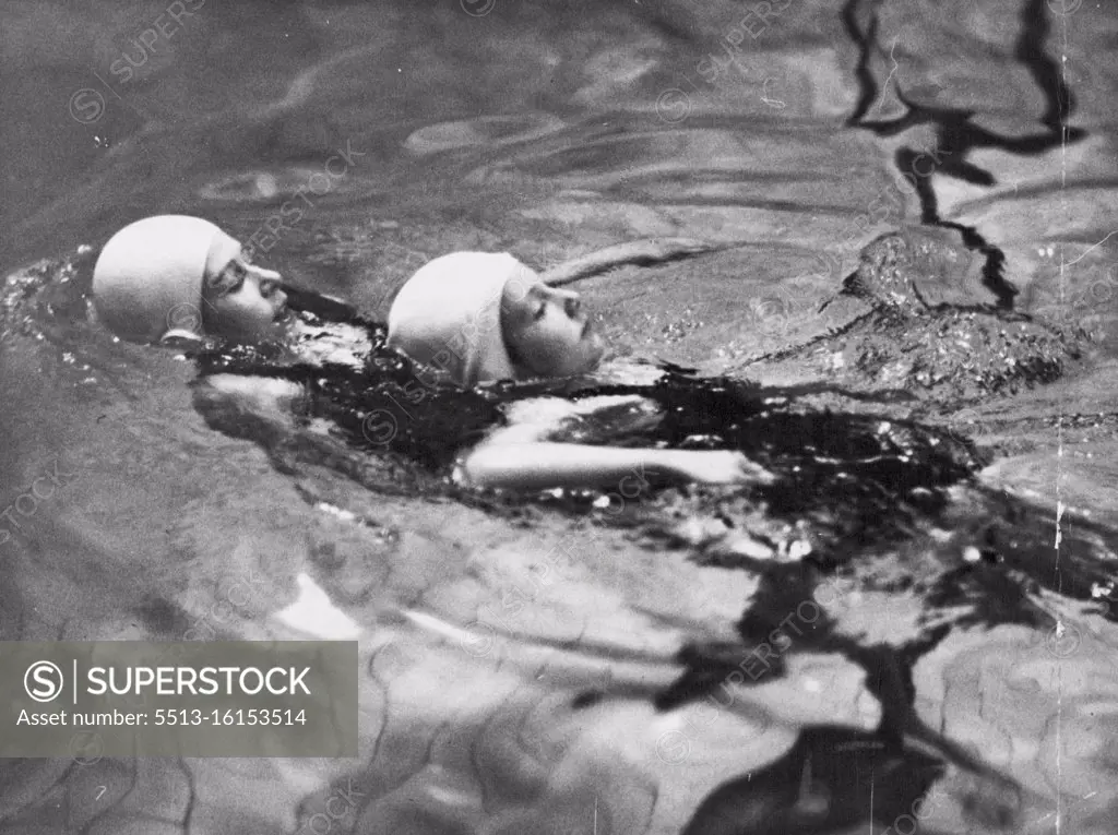 Princess Elizabeth and Princess Margaret Rose, take part in the ladies and children's swimming competition, at the bath club, Piccadilly, London. Princess Elizabeth competing in the life saving competition for the Children's Challenge Shield which she won. Princess Elizabeth rescuing a drowning child. June 28, 1939. (Photo by Sport & General Press Agency Limited).