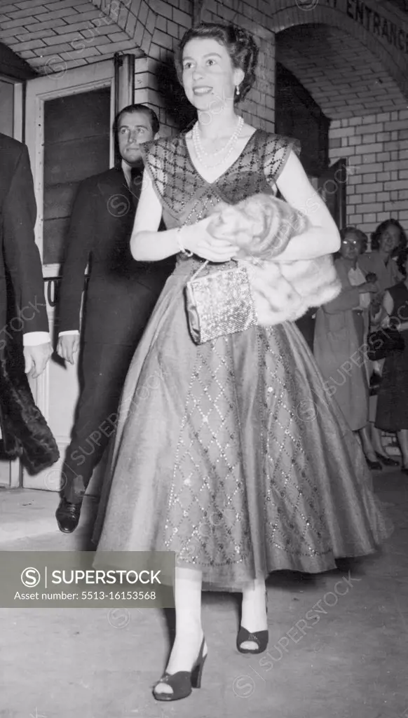 ***** Queen, leaving Wyndham's Theatre, London, after seeing 'The Boy Freind' this evening (Tuesday). Her Majesty watched the musical comedy, which is in the style of the 1920's, from a seat in row 'E' of the stalls. August 3, 1954.