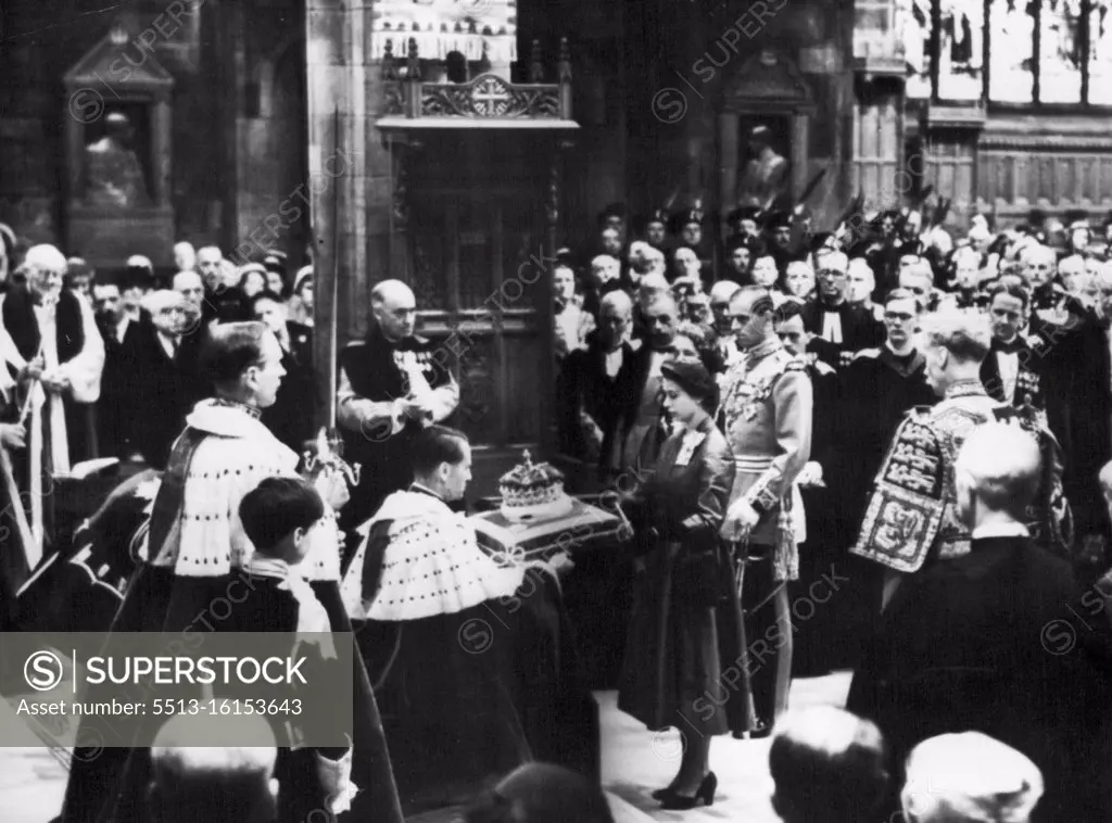 The Queen's Visit to Scotland. During the Queen's Royal visit to Scotland, she attended a national service of thanksgiving and dedication in St.Giles's Cathedral, Edinburgh, today. Picture shows a scene inside the Cathedral - the Queen returns the crown of the Scottish Crown Jewels to the care of the Duke of Hamilton. Prince Philip, in Field-marshal's uniform, stands behind the Queen on her right. June 24, 1953. (Photo by Evening Standard).