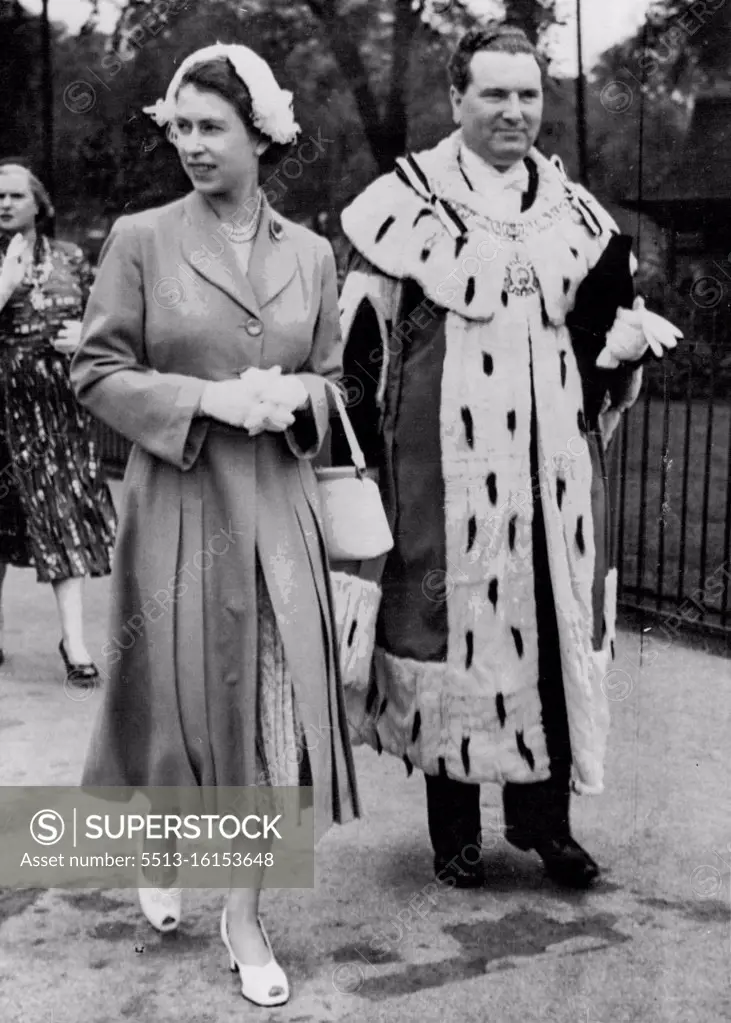 Queen Plants Cherry Tree in Edinburgh. The Queen accompanied by the Lord Provost of Edinburgh, Sir James Miller, as she arrived at the Meadows, Edinburgh, to-day (Tuesday) to plant a cherry tree. The Queen and the Duke of Edinburgh are on a week's Coronation visit to the Scottish capital. They reached the city earlier to-day. June 23, 1953. (Photo by Reuterphoto).