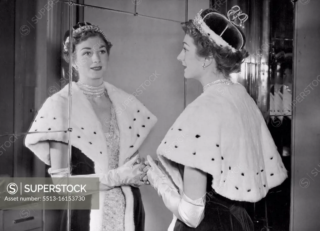 Coronation Robes Exhibition: A close up of the head and shoulders of a new austerity robe being reflected in a mirror. It shows the new cap of state costing £-£4 worn as alternative to £60 coronet. An exhibition opened in London for the private viewing of some three hundred peers and peeresses who have applied for summons to the Coronation. It was held in Mr. Norman Hartnell's salon in Bruton street. Invitations were sent out by the Earl Marshal for peers and peeresses to attend the special showing of dresses robes and head-dresses which have been designed for the Coronation. January 5, 1953. (Photo by Fox Photos).