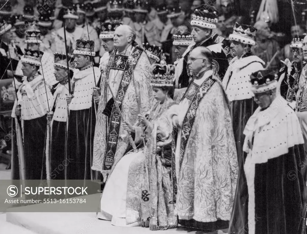 Queen - Of Justice And Mercy -- The Queen, seated upon the Throne and wearing St. Edward's Crown, holds the Royal Sceptre, ensign of kingly power and justice, and the Rod with the Dove, Rod of equity and mercy, as she prepares to receive homage after the crowing in Westminster Abbey, London, to-day. Coronets of peers and peeresses make a splendid background to the scene. June 02, 1953. (Photo by Reuterphoto)