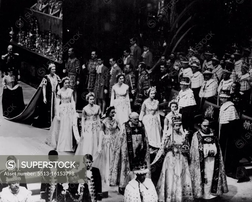 Wearing the Imperial Crown and carrying the Sceptre and Orb, the Queen, attended by her Maids of Honour, leaving the Abbey at the conclusion of the Coronation ceremony. June 02, 1953. (Photo by Daily Mirror). 