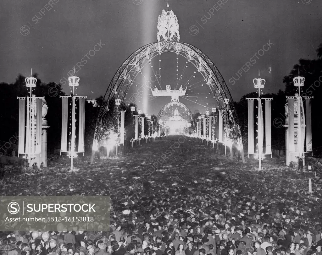 London Rejoices On Coronation Night -- Colossal crowds thronging the magnificently floodlit Mall tonight, which is still a surging mass of happy people form end to end. To terminate the magnificent day of pageantry and splendour London is rejoicing after the Coronation of the Queen, Streets and buildings are floodlit, balls are taking place, wonderful firework displays are being enjoyed and everyone is celebrating in their own particular way. June 02, 1953. (Photo by Fox Photos).