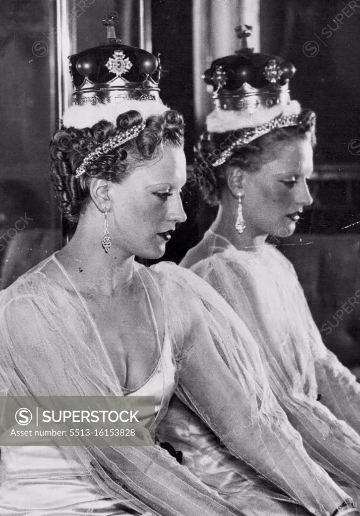 The Official Coronation Hair styles -- These styles have been designed by expert hairdressers under the direction of the incorporated guild of hair dressers, wig makers and perfumers, and are shown in London. Called the curl crown Halo. This style can be worn with Tiara, Coronet, or purely as an evening style. It is seen here worn with a Duchess's Coronet. March 23, 1937. (Photo by Sport & General Press Agency, Limited).