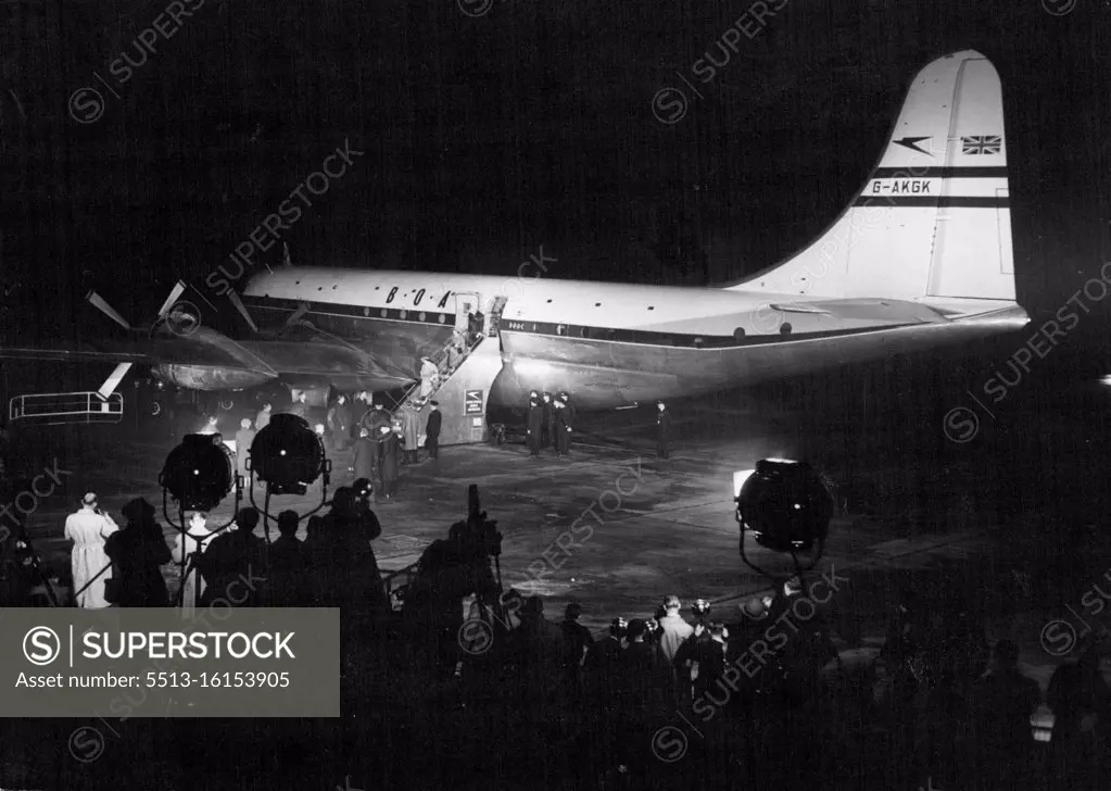 Royal Couple Off To Canada -- The Floodlights playing on the huge Canopus. In their glare the Queen, Followed by Princess Margaret, is seen walking down the Gangway. The goodbyes have been said. and a few minutes after this picture was taken the Royal Plane Took off. Scenes at London Airport last night when Princess Elizabeth and the Duke of Edinburgh were boarding the Strato-Cruiser Canopus for their 3,400-mile flight to Canada. October 08, 1951. (Photo by Paul Popper).