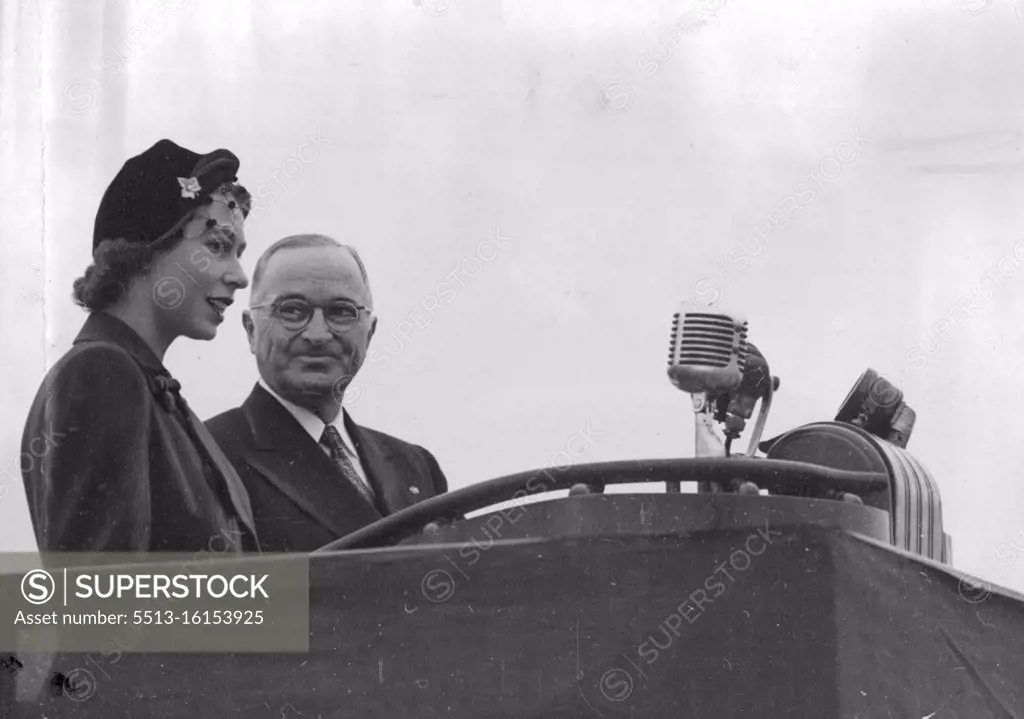 Princess Elizabeth Meets The President -- Princess Elizabeth with the President facing a Barrarge of Microphones after her arrival at Washington Airport. Princess Elizabeth and the Duke of Edinburgh have broken their Canadian tour to spend a few days in the United States at the Invitation of President Truman. November 02, 1951. (Photo by Paul Popper Ltd.). 