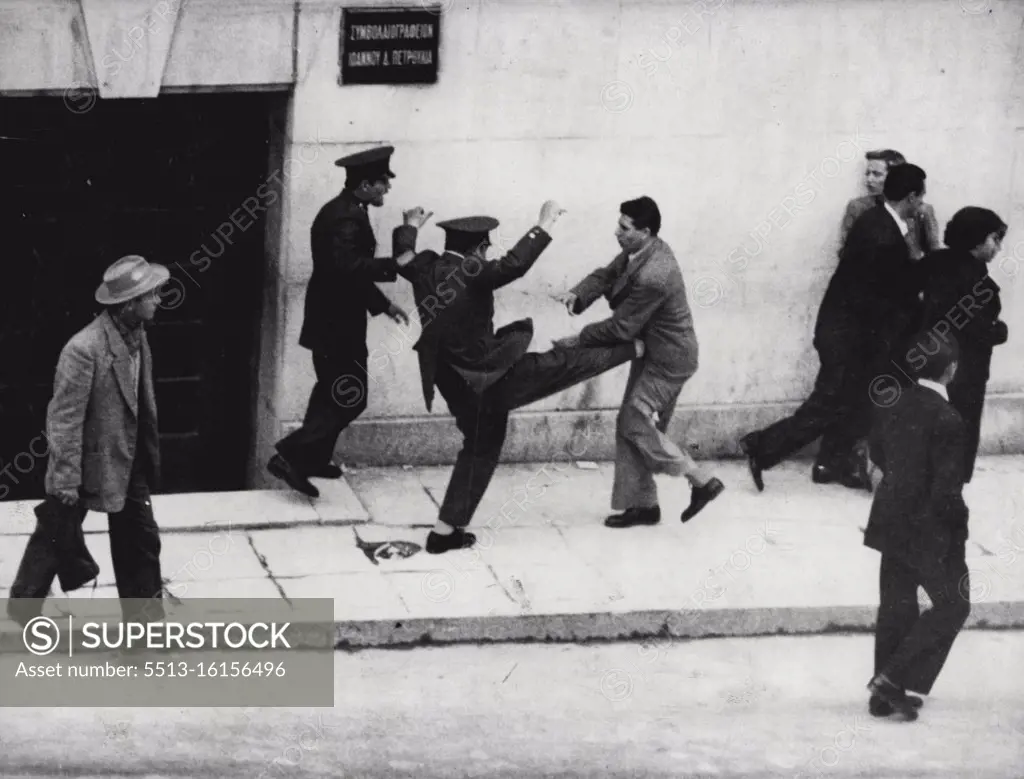 The sort of thing football talent scouts dream about. The photograph shows a Greek policeman in action in Athens the other day. Police some of them armed with clubs, broke up a demonstration by about 700 students who were agitating for "Enosis" (Union between Greece and Cyprus). The police earlier, had banned the demonstration. April 21, 1955. (Photo by The Associated Press Ltd.).