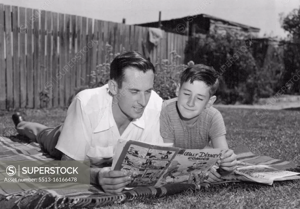 Ernie Paez, outright favorite for today's Bendigo Thousand, gets a laugh from the comics as he relaxes with John Norwood before the big race. Paez is staying with John's parents in North Bendigo. March 16, 1955.