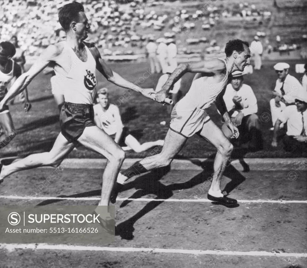 Heading For The Str­etch - John Watchler passes the stick to anchor man Cliff Bourland of the Los Angeles A.C. as he takes off into the stretch to win the 1600- meter relay at the National AAU meet here today. July 05, 1947. (Photo by AP Wirephoto).