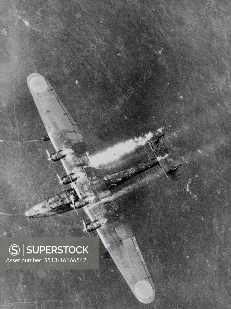 Smoke and flames of a ***** Japanese flying-boat which exploded just before hitting the water after having been damaged from a 7.7 m.m. shell in action against the U.S. forces in the vicinity near Truck. June 21, 1944. (Photo by Official, U.S. Navy Photograph).