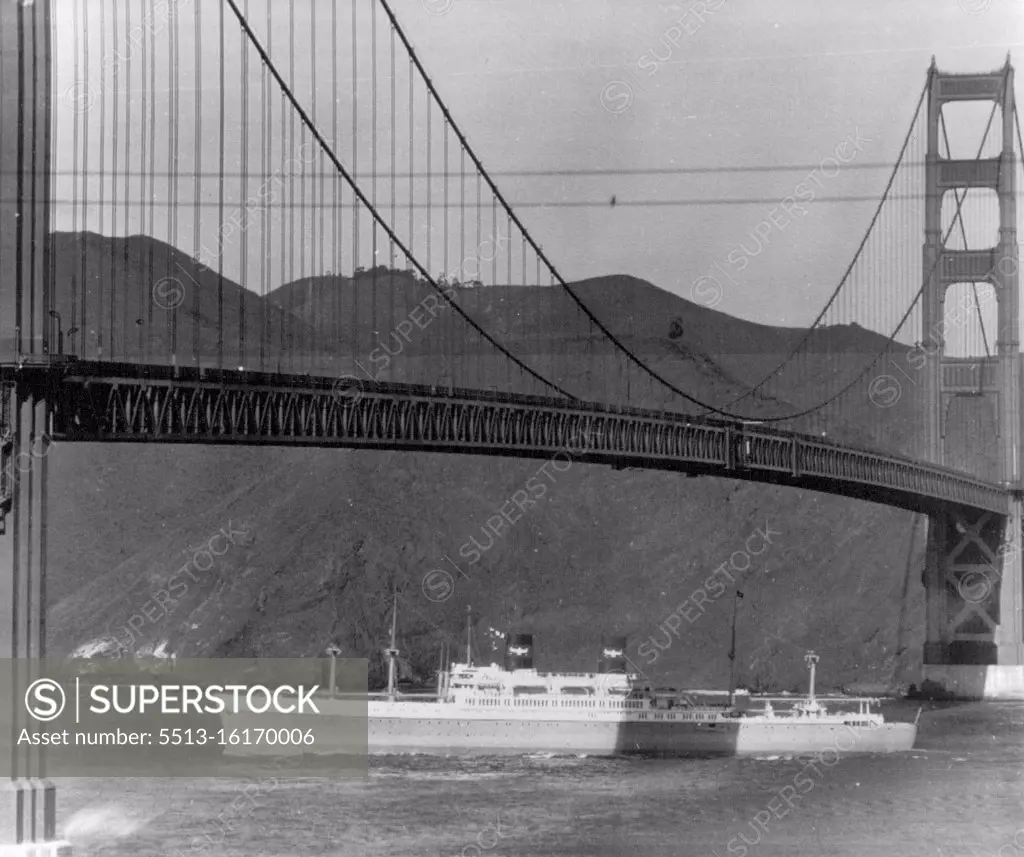 S. S. President Cleveland Heads Seaward For First Trail -- The S.S. President Cleveland, largest passenger vessel ever built on the Pacific Coast, sticks her bow out through the Golden Gate here today and heads seaward for her first day of trials. The Cleveland,her rut by the shadow cast by the Golden Gate Bridge, looks huge. displaces 23,000 tons is 610 feet long carries 550 passengers and a of 340. December 8, 1947. (Photo by AP Wirephoto). 