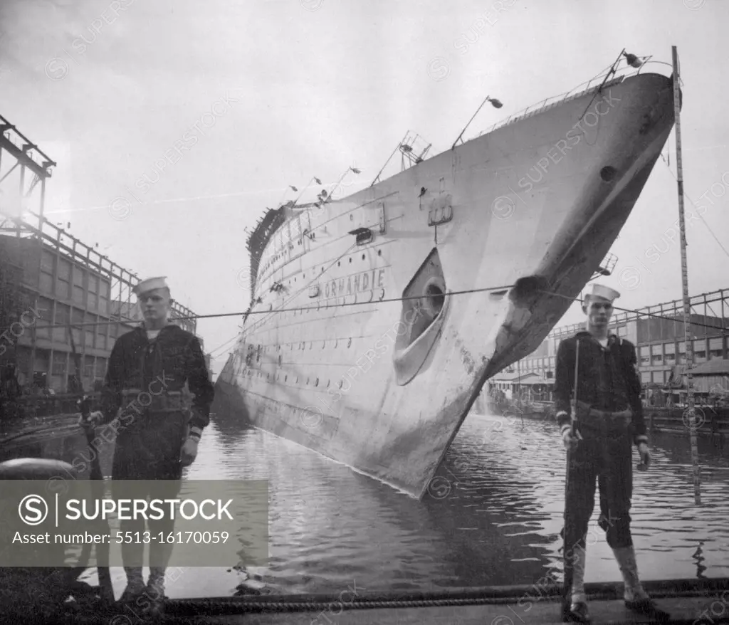 Former Normandie's list cut to 27.5 degrees the U.S.S. Lafayette, former French Luxury Liner Normandie, reaches this angle -- 27.5 degrees--during salvage operations at her Hudson River slip, New York City, Aug. 20. August 21, 1943. (Photo by Associated Press Photo). During World War II, Normandie was seized by U.S. authorities at New York and renamed USS Lafayette. In 1942, the liner caught fire while being converted to a troopship, capsized onto her port side and came to rest on the mud of the Hudson River at Pier 88