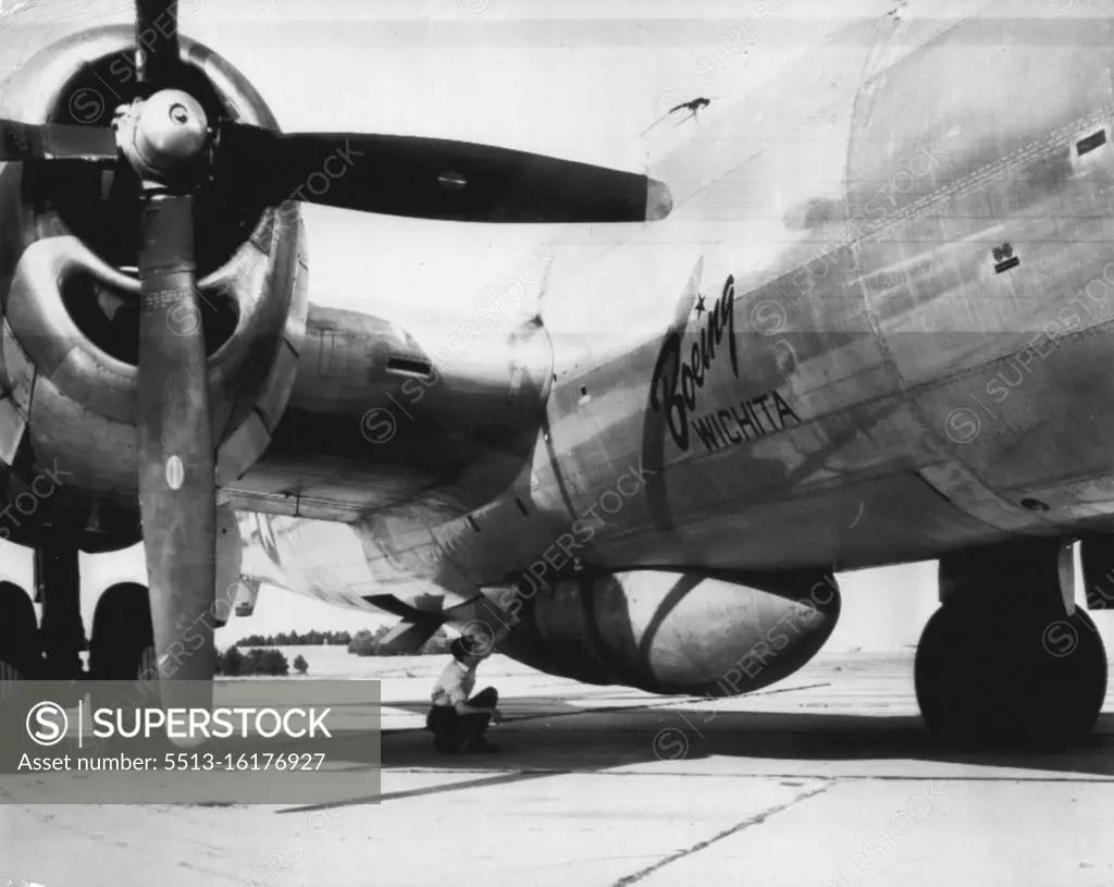 Modified B-29 to carry 21-ton bomb - Here's way new 42,000-pound bomb being developed by Army Air Forces looks when attached to a Boeing B-29 Superfortress which was modified by Boeing plant here to carry huge bomb. First tests of bomb will be made within few months. July 25, 1947. (Photo by AP Wirephoto).