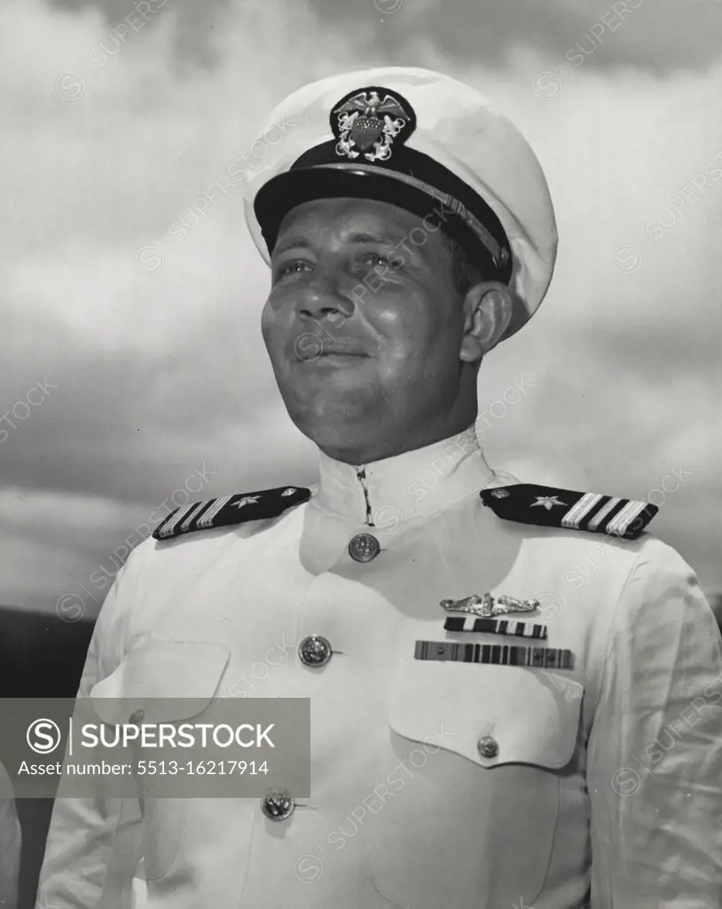 Lieut. Comdr. Wreford Goss Chapple, USN, of 1002 North 30th Street, Billings, Mont., is shown just after Rear admiral C.A. Lockwood, Commander Submarine force, U.S. Pacific Fleet, awarded him the Navy's Gold Star in lieu of a second Navy Cross at Pearl Harbor Ceremonies. As Commending Officer of a United States Submarine in Enemy Waters, Lieut. Comdr. Cahpple Sank two ships of a Japanese Convoy and on two other attacks Severely Damaged two Enemy freighters. August 22, 1943. (Photo by Official U.S. Navy Photo)