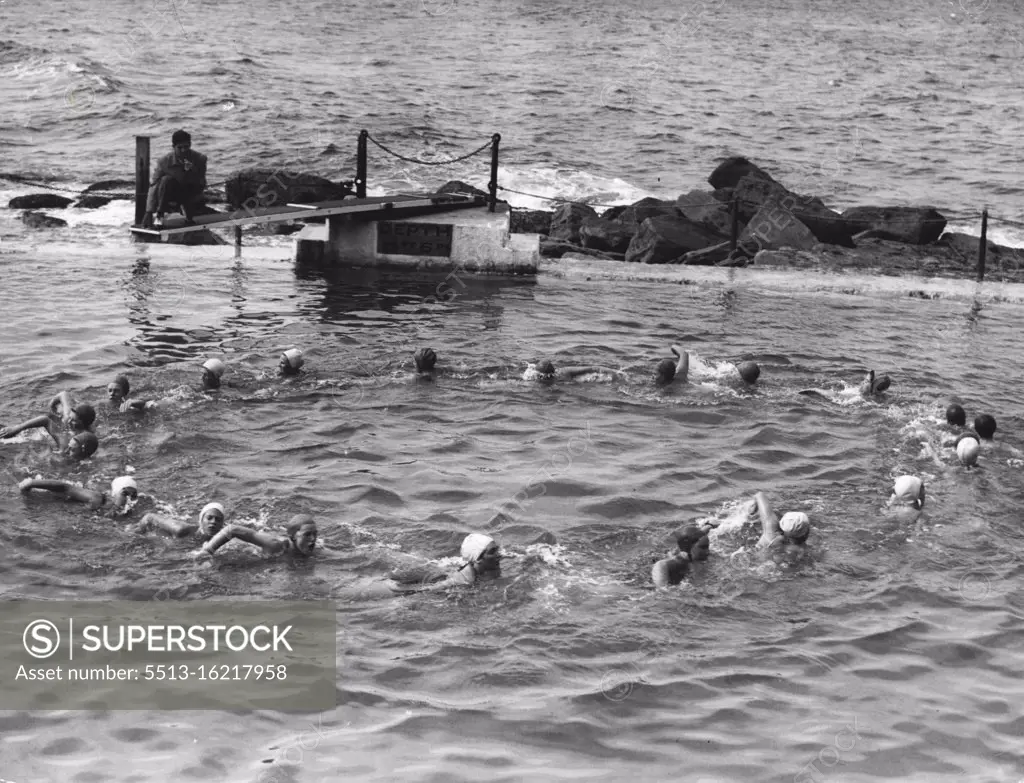 Mr. Sid Dyer training twenty Brontey surf girls in their water - ballet routines for the Aquacade ***** Olympic Poll on Frid & Sat nights. April 5, 1948.