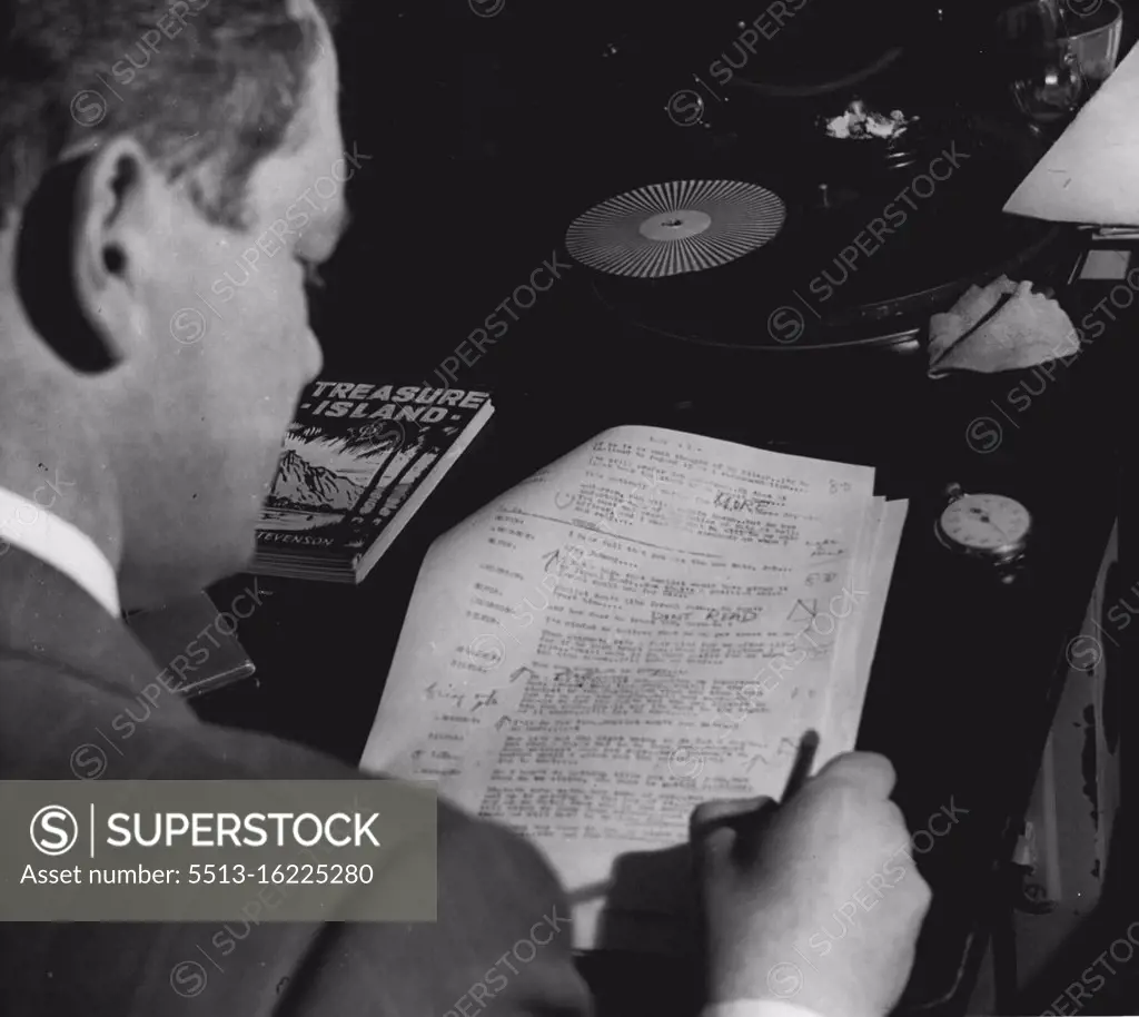 Paul Jacklin, Production Manager of 2UE, listens to rehearsal of Treasure Island marks script to remind himself where alterations in actors portrayal of role. July 6, 1951.