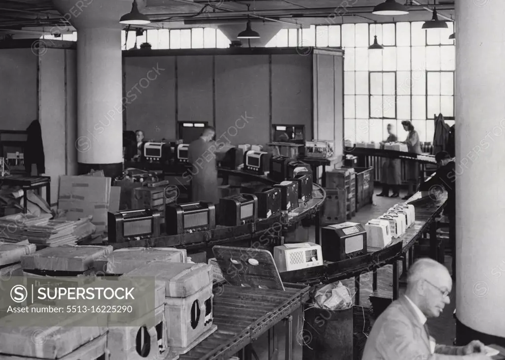 Radio Industry Passes Export Target -- The British Radio Industry has decided not to hold a Radio Exhibition this year in order that manufacturers may concentrate upon their export programme which is forging ahead with great success. The export target of £1m set the industry by Sir Stafford Cripps was passed in December last when equipment to the value of £1,013,162 was sold a broad. This picture was taken at the huge Electrical and Musical Industries (EMI) factory at Hayes, Middlesex, where much of the export work is carried on. In this picture the conveyer is bringing finished sets from numerous departments into the packing room. March 24, 1948.