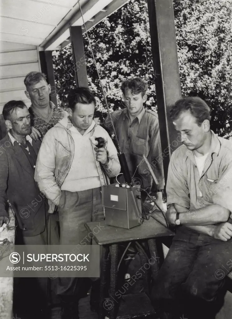 George Couzens in charge head Qts. on Hotel Verandah. Talks on walkie talkie, he is Regional Surveyor snowly mtns Hydro Elect authority. December 22, 1953.