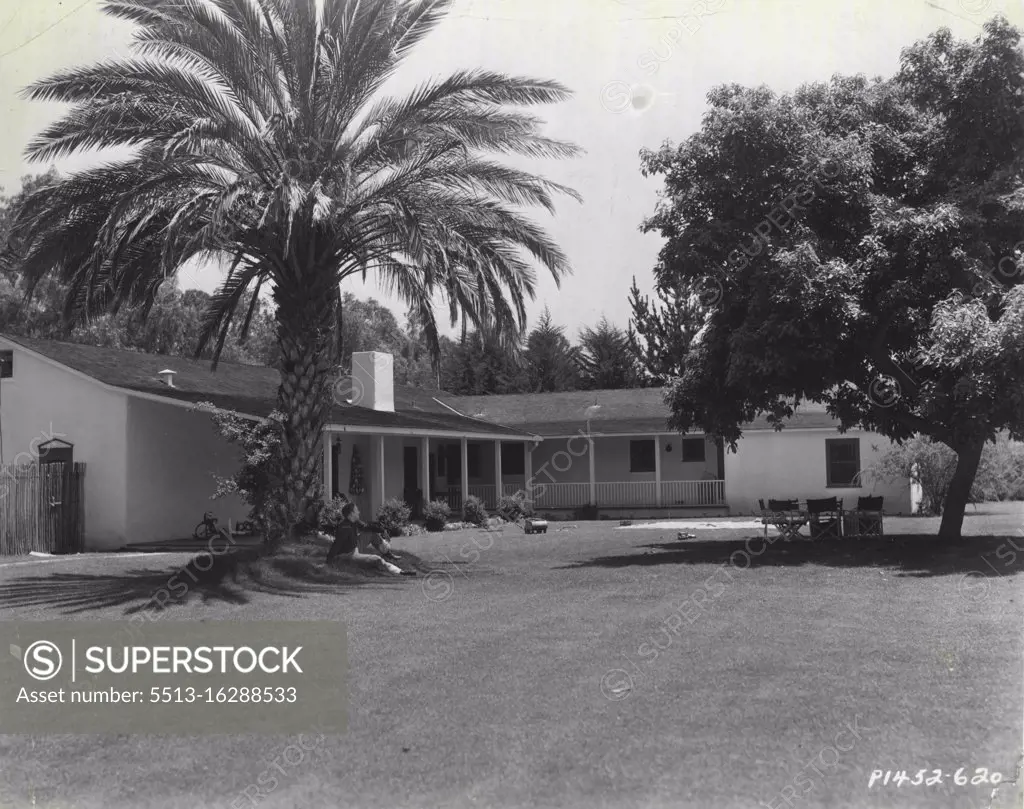 Crosby Castle --- Here is the adobe ranch house Built on Bing Crosby's Extended Acreage at Sante Fe Racho Estates, Near Del Mar, California, and There is the old Crooner himself, Sitting right in the shade of the Fluttering palm. January 01, 1941. 