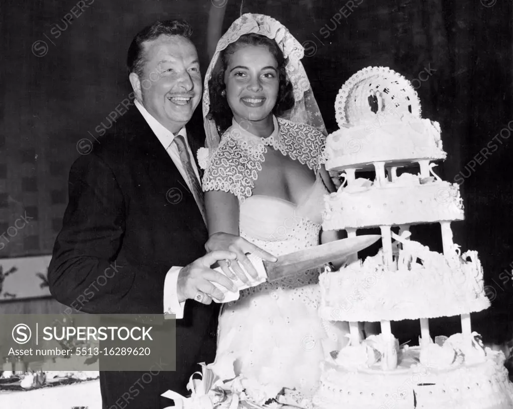 Rhumba King Xavier Cugat and Singer Abbe Lane Cut Their wedding cake at Miami Beach, Florida, May 5, 1952, after their wedding at the Casablanca Hotel. Xavier Cugat and Abbe Lane used a fearsome-looking knife to cut the wedding-cake after their marriage in 1952 at a hotel in Miami, Florida. July 27, 1955. 