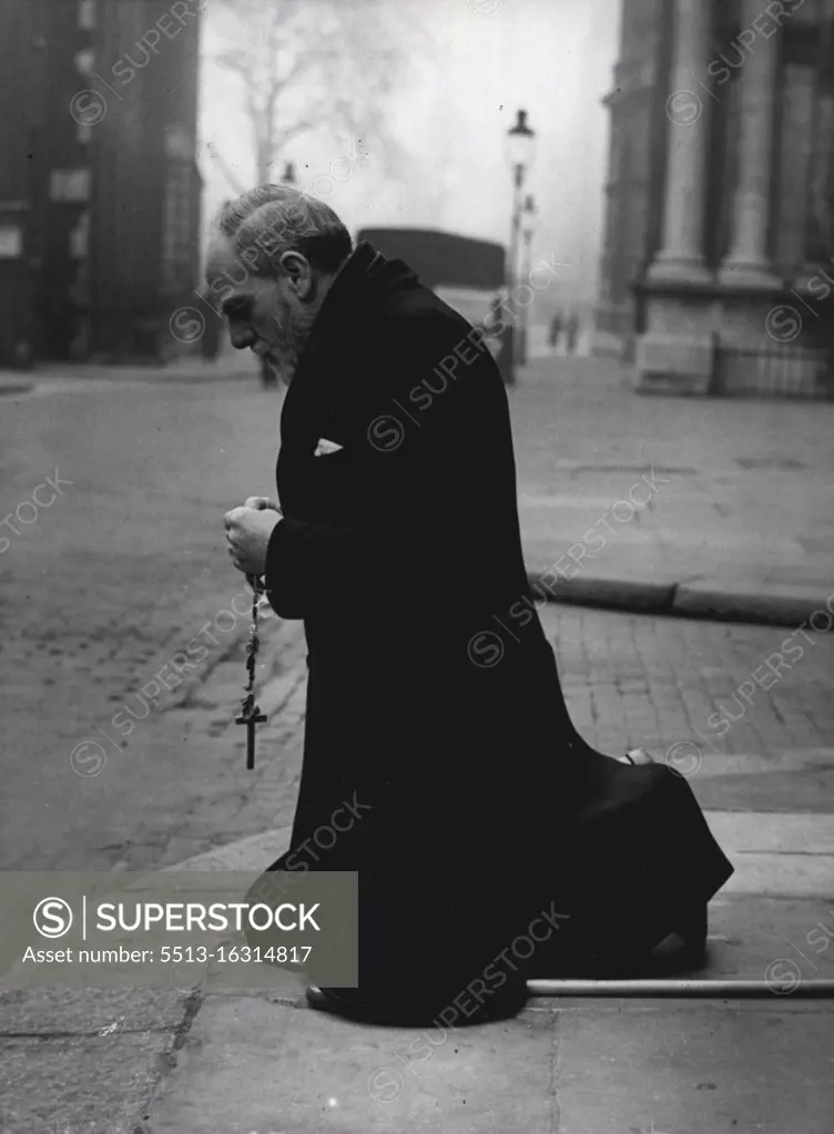 Praying For A Government -- This exclusive picture was taken in Downing Street, London, this afternoon. The photographer, waiting outside No. 10. for the Prime Minister, Sir Winston Churchill, Saw this elderly ***** enter the empty street from Whitehall. On the far side but immediately opposite No. 10. the figure halter, went down in his knees in a prying position. The elderly prayer was 60-year-old Labert Roche. Afterwards he said that he was praying for a Christian democratic government "for the peace of the world." 60-year-old Labert Roche prays on the pavement opposite 10 Downing St. London, the residence of Sir Winston Churchill. Roche said he was praying "for a Christian democratic government and world peace." March 29, 1955. (Photo by Paul Popper Photo) 