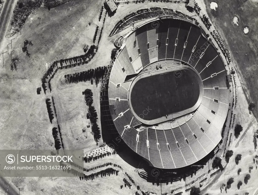 Classic Rose Bowl Turns To Bike Races : This is the Classic Rose Bowl in Pasadana, Calif., where the annual Rose Tournament football contests are decided. Its 86,000 seats will be filled by a far different crowd in August, however, when the cycling races of the Xth Olympiad are staged within the big saucer. The board track, constructed at a cost of $10,000 can be seen surrounding the gridiron. Photo taken from the Gilmore Lion airplane piloted by Colonel Roscoe Turner. July 15, 1932. (Photo by Associated Press Photo).