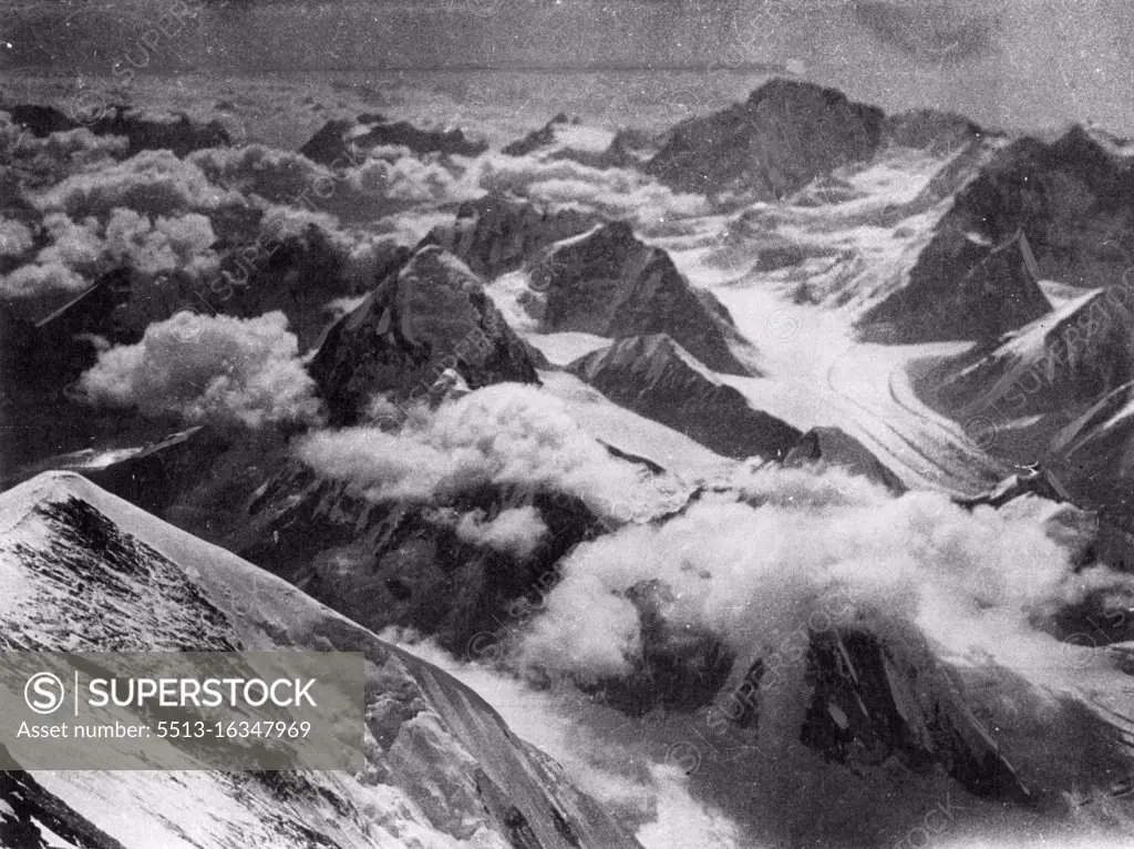 The Highest Point in the World at which Photographers have ever been taken (The Mount Everest Expedition: "The Times" Service) A panorama of the other mountains of the Everest group taken by Mr. Somervell from the same point on Mount Everest as picture No 73 - at a height of 28,000 feet above sea level. About the view from his point Mr. Somerwell wrote: "Around we saw a perfect sea of fine peaks, all giants among mountains, all as dwarfs below us. The view, indeed, was indescribable, and one simply seemed to be above everything in the world." August 22, 1924.